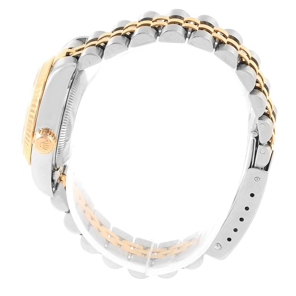 The image shows a side view of a Rolex Datejust 79173 Women's Stainless Steel Silver Dial 79173 Women's Stainless Steel Silver Dial watch, highlighting its case, crown, and Jubilee bracelet.