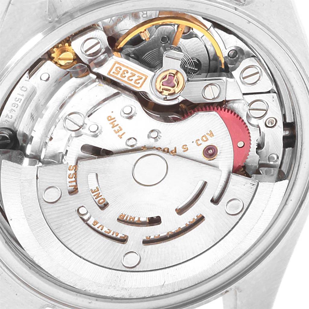 This image shows the inner mechanics of a Rolex Datejust 79173 Women's Stainless Steel Silver Dial 79173 Women's Stainless Steel Silver Dial watch, including gears and the rotor mechanism.