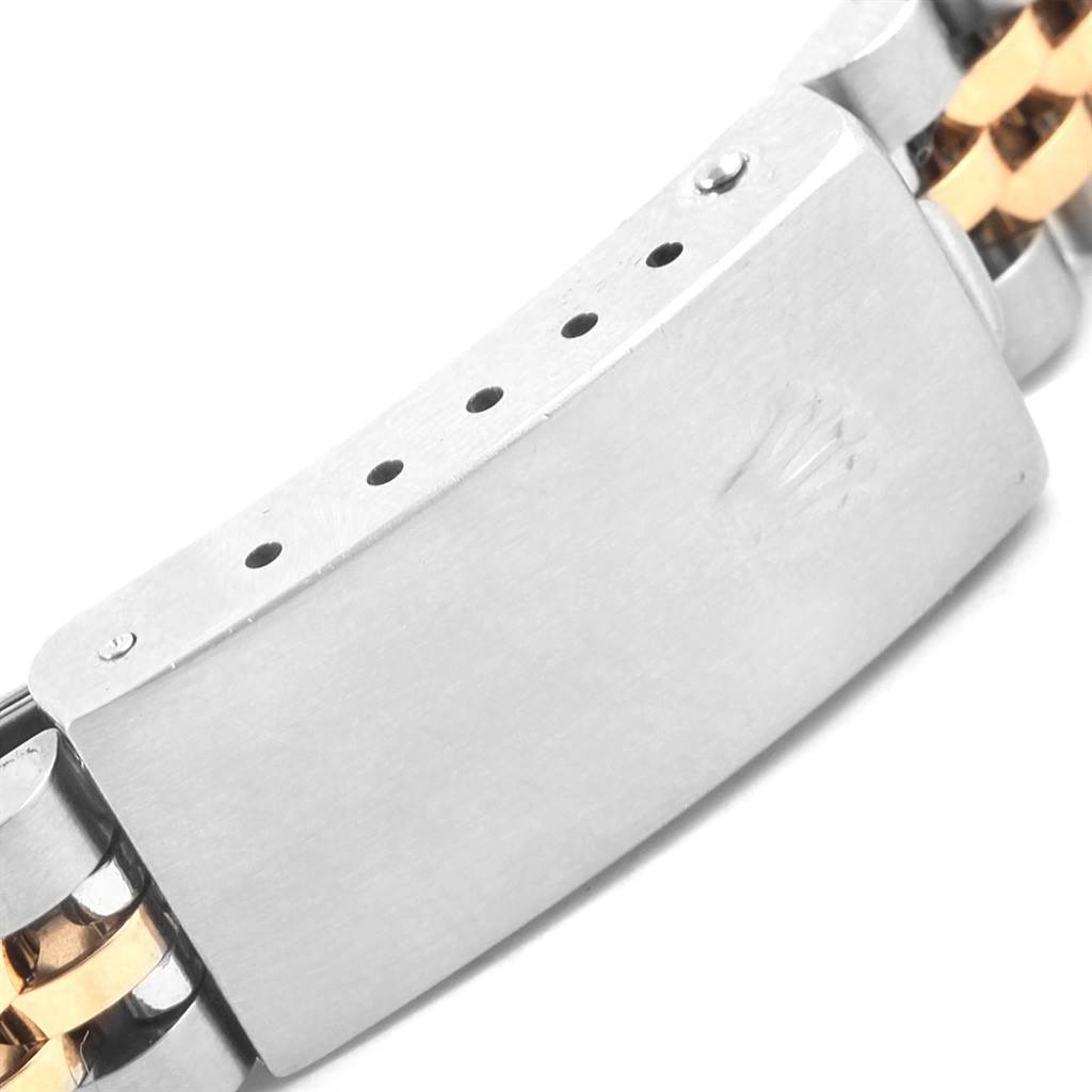 The image shows the clasp of a Rolex Datejust 79173 Women's Stainless Steel Silver Dial 79173 Women's Stainless Steel Silver Dial watch, highlighting its metallic parts and logo engraving.