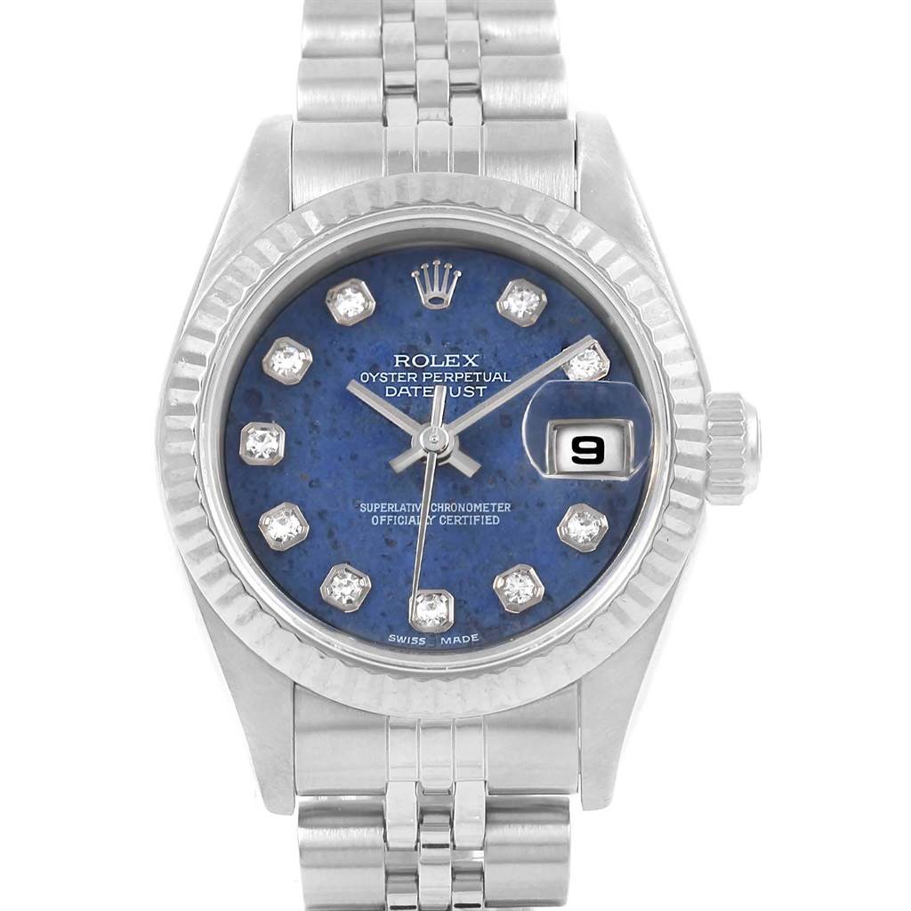 The image shows a front view of a Rolex Datejust 79174 Women's Stainless Steel Blue Dial 79174 Women's Stainless Steel Blue Dial watch, highlighting its blue dial, date display, and diamond hour markers.