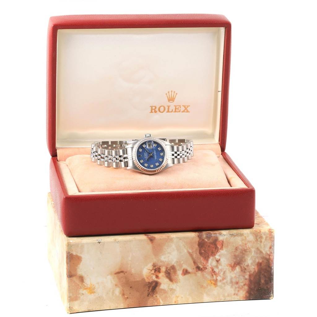 The Rolex Datejust 79174 Women's Stainless Steel Blue Dial 79174 Women's Stainless Steel Blue Dial watch is displayed front-facing in its open box, showing the dial, bezel, and bracelet.