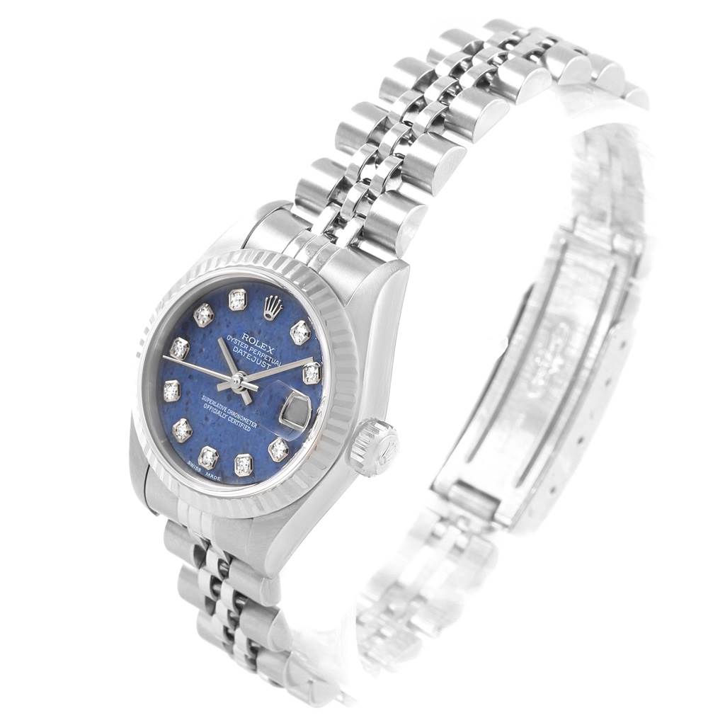 The image shows a Rolex Datejust 79174 Women's Stainless Steel Blue Dial 79174 Women's Stainless Steel Blue Dial watch angled left, featuring its face, dial, crown, and part of the bracelet.