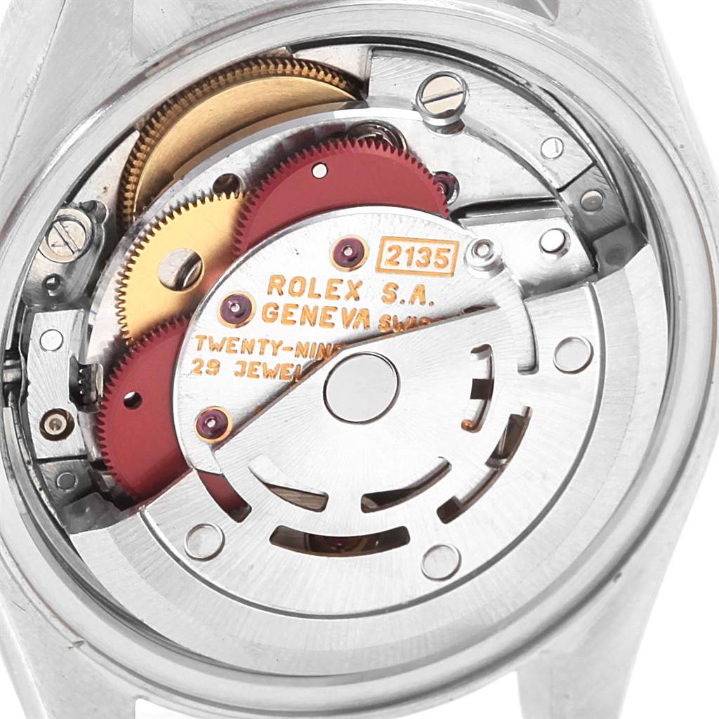 The image shows the internal mechanism of a Rolex Datejust 69173 Women's Stainless Steel White Dial 69173 Women's Stainless Steel White Dial watch, focusing on the movement labeled "Rolex S.A. Geneva Switzerland."