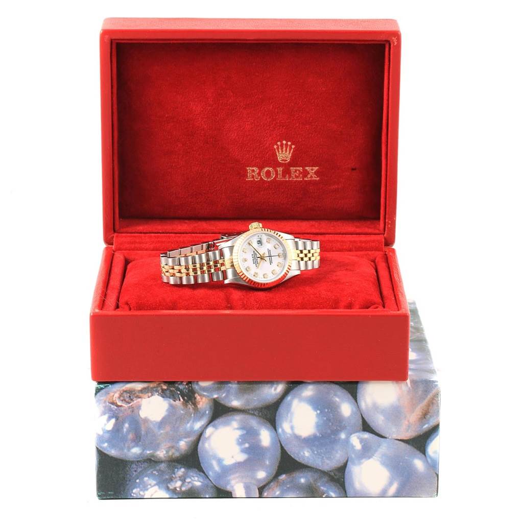 The Rolex Datejust 69173 Women's Stainless Steel White Dial 69173 Women's Stainless Steel White Dial watch is shown straight on in an open red box, displaying the face, bracelet, and some of the packaging.