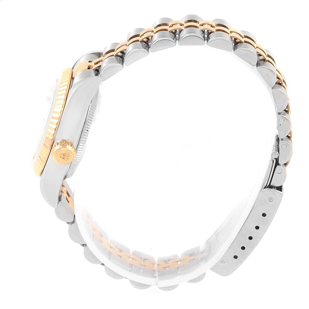 The image shows a side profile of a Rolex Datejust 69173 Women's Stainless Steel White Dial 69173 Women's Stainless Steel White Dial watch, highlighting the crown, bezel, and the two-tone bracelet.