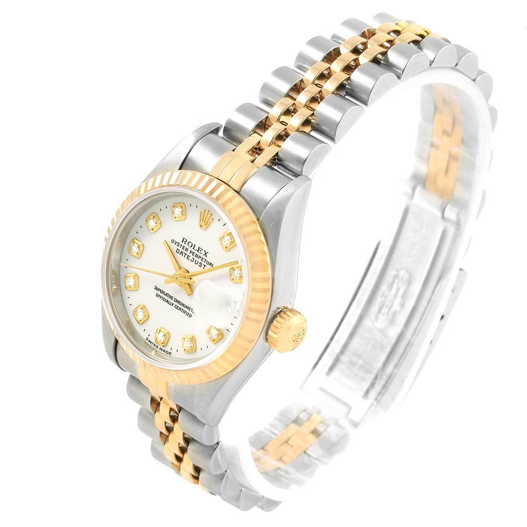 This image shows a Rolex Datejust 69173 Women's Stainless Steel White Dial 69173 Women's Stainless Steel White Dial watch with a two-tone bracelet, fluted bezel, and diamond hour markers, at an angled side view.