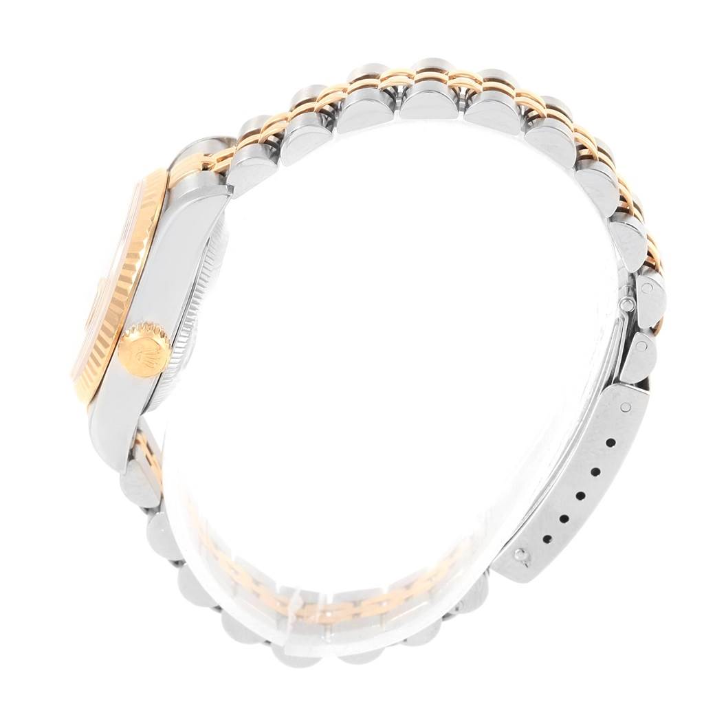 This image shows a side view of a Rolex Datejust 69173 Women's Stainless Steel Silver Dial 69173 Women's Stainless Steel Silver Dial watch focusing on the bezel, crown, and bracelet.