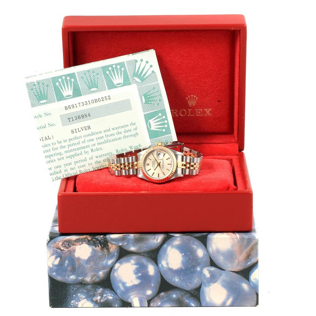 The image shows a Rolex Datejust 69173 Women's Stainless Steel Silver Dial 69173 Women's Stainless Steel Silver Dial watch in its open box, along with its papers.