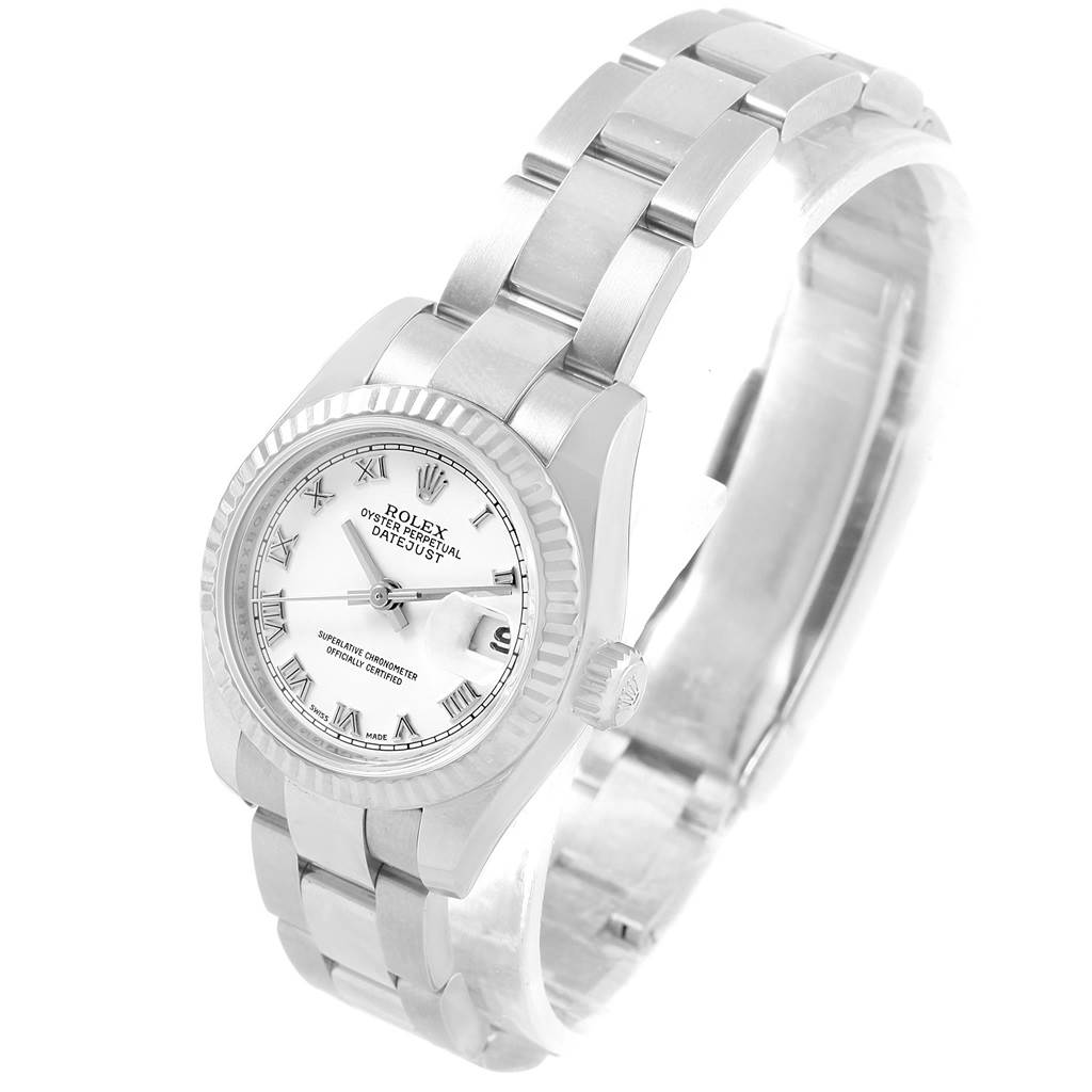 This Rolex Datejust 179174 Women
s Stainless Steel White Dial 179174 Women
s Stainless Steel White Dial watch is shown from a three-quarter angle, displaying the face, bracelet, and side.
