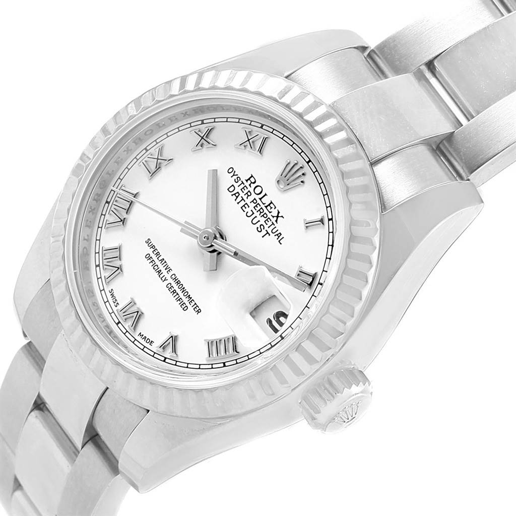 This image shows the dial, bezel, crown, and part of the bracelet of a Rolex Datejust 179174 Women
s Stainless Steel White Dial 179174 Women
s Stainless Steel White Dial watch at a tilted angle.