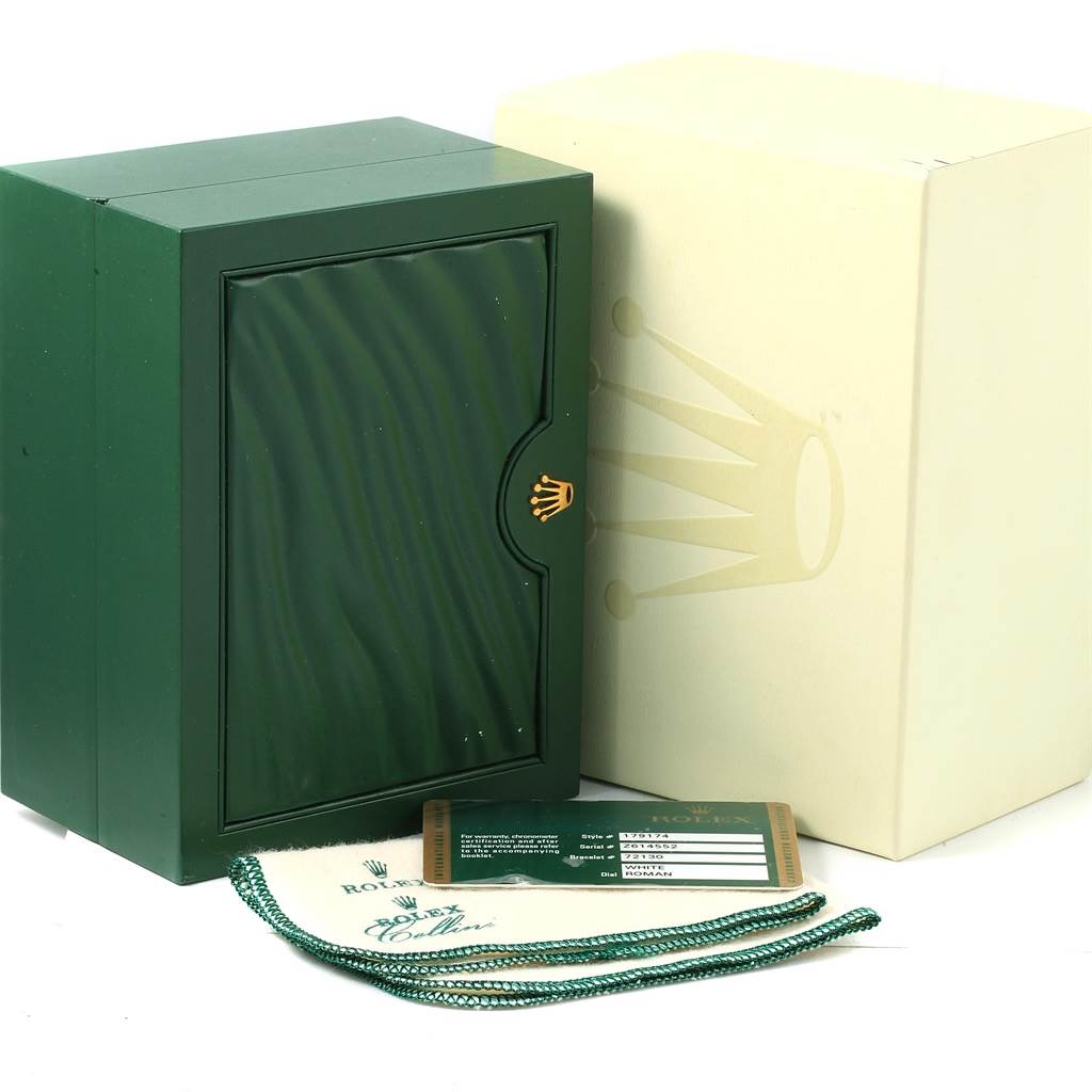 This image shows the box and accessories for a Rolex Datejust 179174 Women
s Stainless Steel White Dial 179174 Women
s Stainless Steel White Dial watch, including the green box, outer box, warranty card, and tags.
