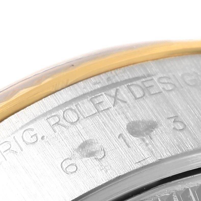 The image shows a close-up of the edge of the case back for the Rolex Datejust 69173 Women's Stainless Steel Blue Dial 69173 Women's Stainless Steel Blue Dial watch.
