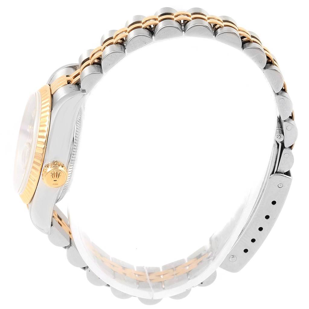 This photo of a Rolex Datejust 69173 Women's Stainless Steel Blue Dial 69173 Women's Stainless Steel Blue Dial watch shows a side view highlighting the crown, bezel, and two-tone bracelet.