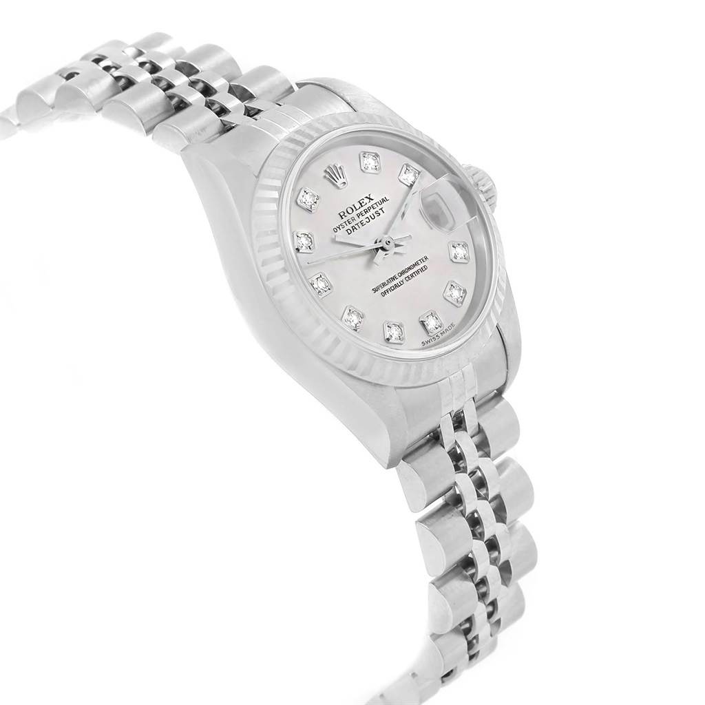 The image shows a Rolex Datejust 79174 Women
s Stainless Steel Mother of Pearl Dial 79174 Women
s Stainless Steel Mother of Pearl Dial watch from an angled view, highlighting the face, bezel, and part of the bracelet.