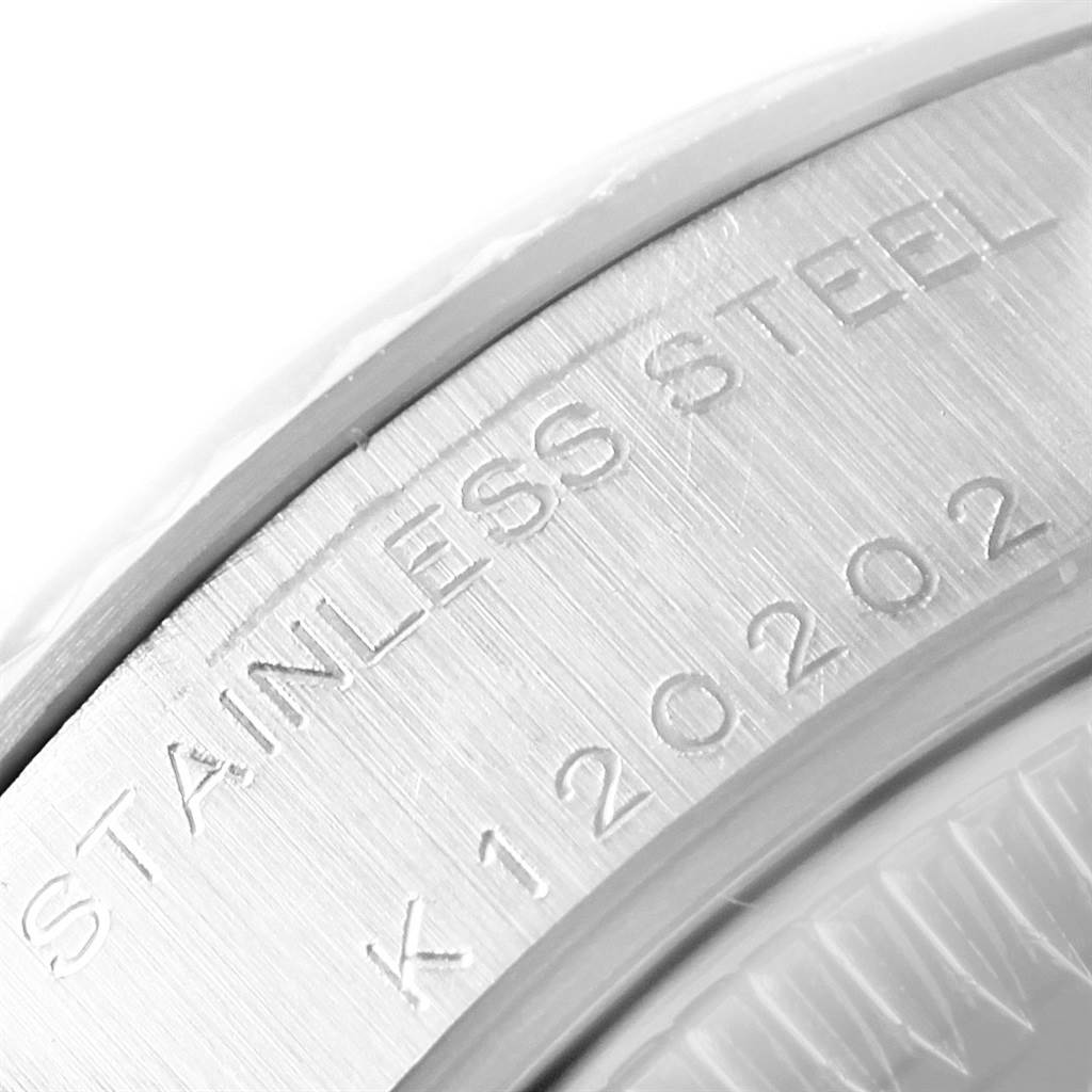 This image shows a close-up of the stainless steel marking and serial number on a Rolex Datejust 79174 Women
s Stainless Steel Mother of Pearl Dial 79174 Women
s Stainless Steel Mother of Pearl Dial watch.