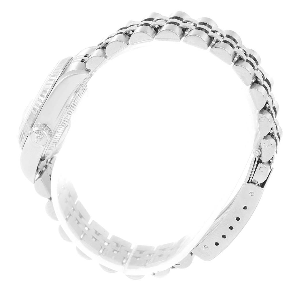 This Rolex Datejust 79174 Women
s Stainless Steel Mother of Pearl Dial 79174 Women
s Stainless Steel Mother of Pearl Dial watch is shown from a side angle highlighting the watch band and case profile.