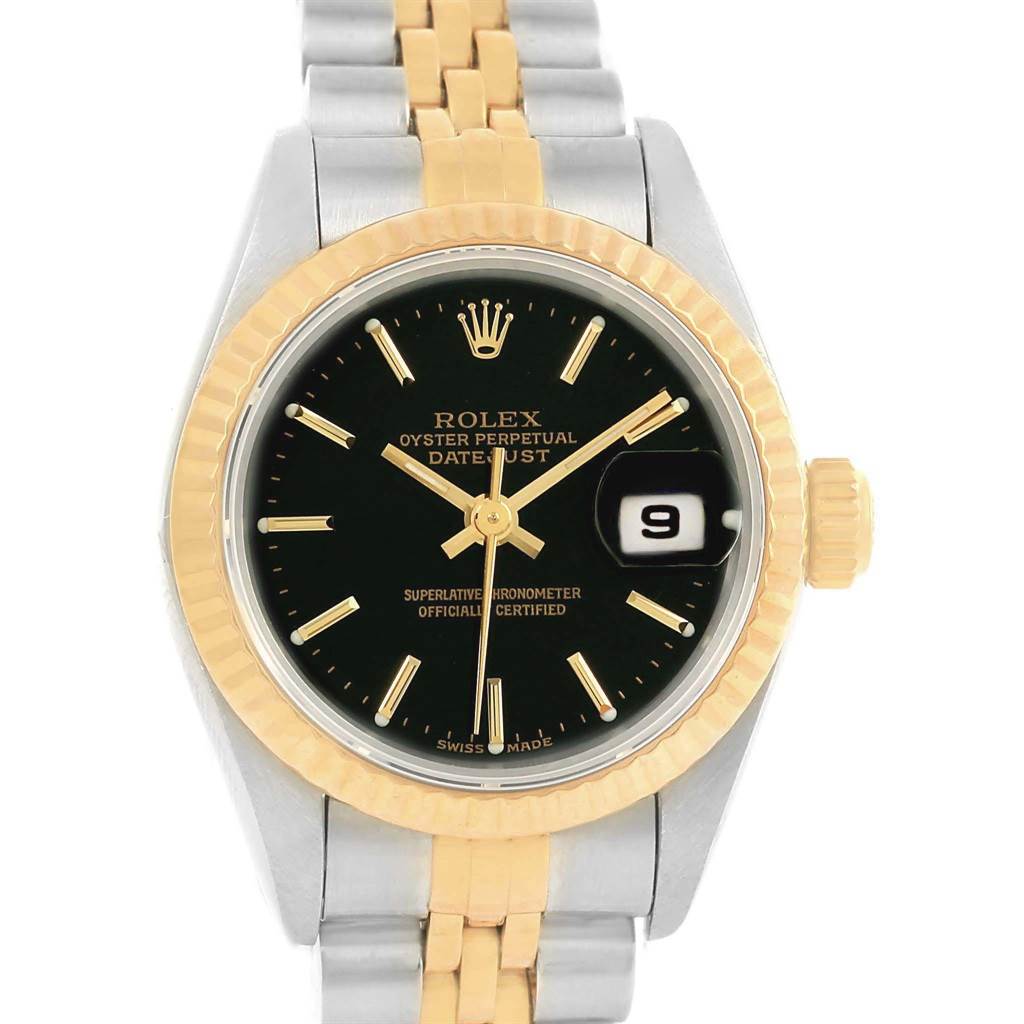 This image shows a close-up of the face, bezel, and part of the bracelet of a Rolex Datejust 79173 Women
s Steel and Gold (two tone) Black Dial 79173 Women
s Steel and Gold (two tone) Black Dial watch.