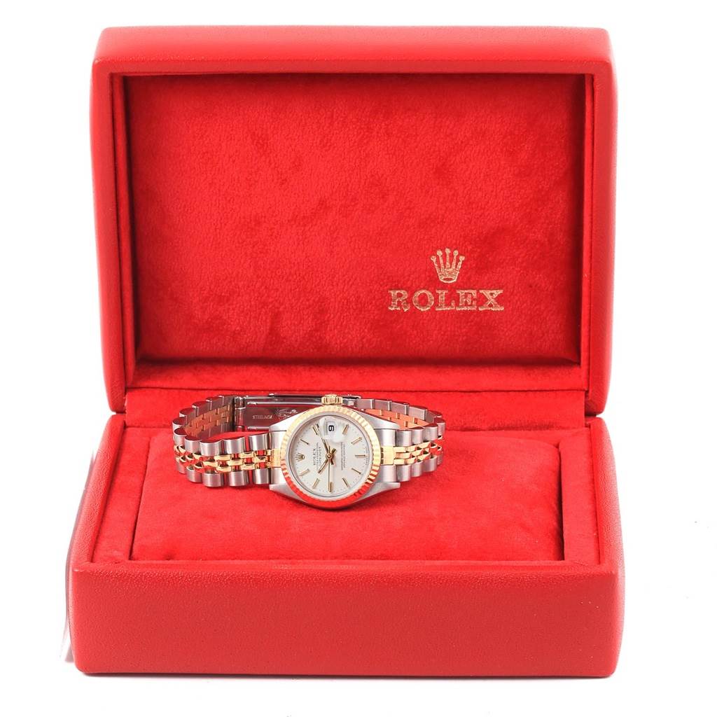 The Rolex Datejust 79173 Women's Steel and Gold (two tone) Silver Dial 79173 Women's Steel and Gold (two tone) Silver Dial watch is shown from a front angle in an open red box.