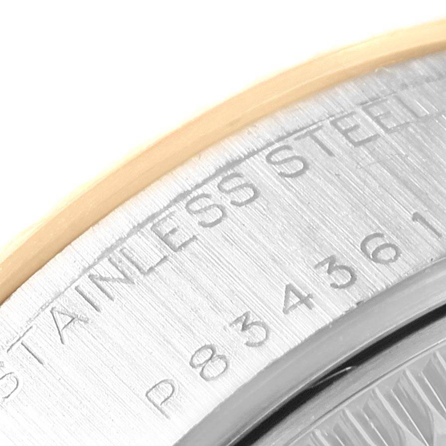 This image shows the engraved rim of a Rolex Datejust 79173 Women's Steel and Gold (two tone) Silver Dial 79173 Women's Steel and Gold (two tone) Silver Dial watch, specifically highlighting the "Stainless Steel" marking and part of the serial number.