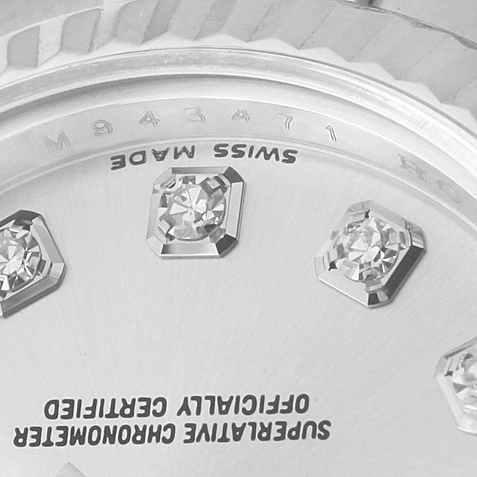 This is a close-up angle showing the bezel, part of the dial, diamond hour markers, and engravings of a Rolex Datejust 179174 Women's Stainless Steel Silver Dial 179174 Women's Stainless Steel Silver Dial watch.