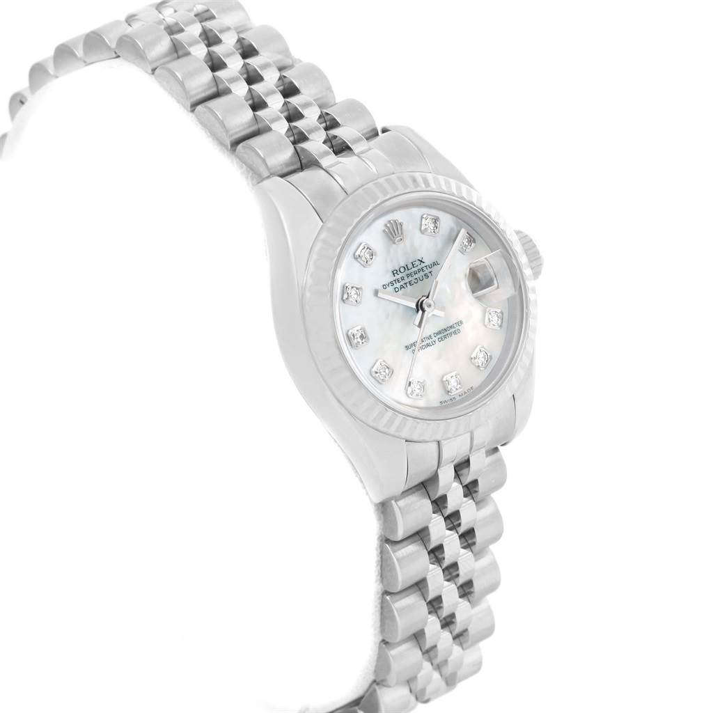 The Rolex Datejust 179174 Women
s Stainless Steel Mother of Pearl Dial 179174 Women
s Stainless Steel Mother of Pearl Dial watch is shown at a slight angle displaying the face, bezel, and part of the Jubilee bracelet band.
