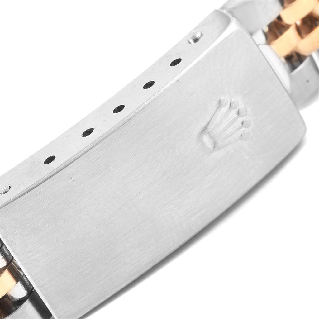 The image shows the clasp of a Rolex Datejust 79173 Women
s Stainless Steel Blue Dial 79173 Women
s Stainless Steel Blue Dial watch from a close-up angle, featuring the Rolex crown logo.