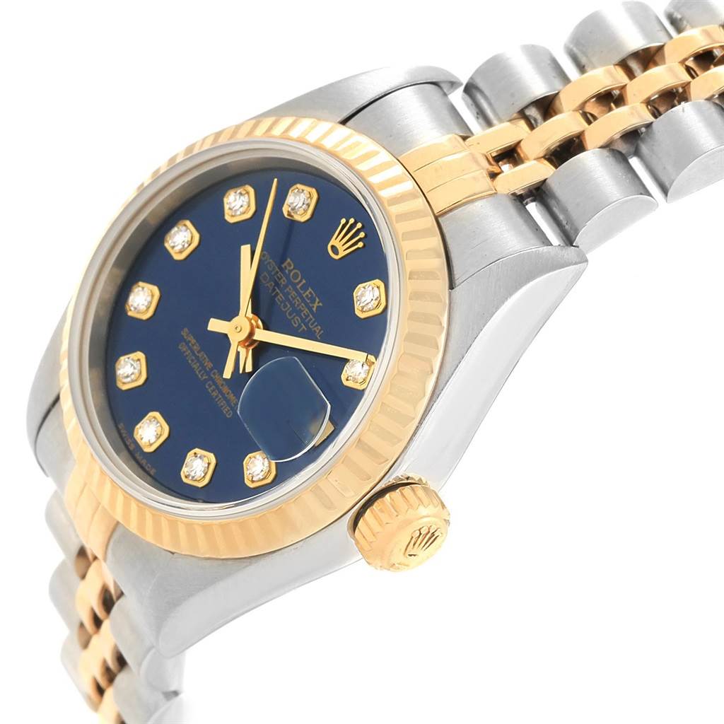This image shows a 3/4 angle view of a Rolex Datejust 79173 Women
s Stainless Steel Blue Dial 79173 Women
s Stainless Steel Blue Dial with a blue dial, diamond markers, and a two-tone bracelet.