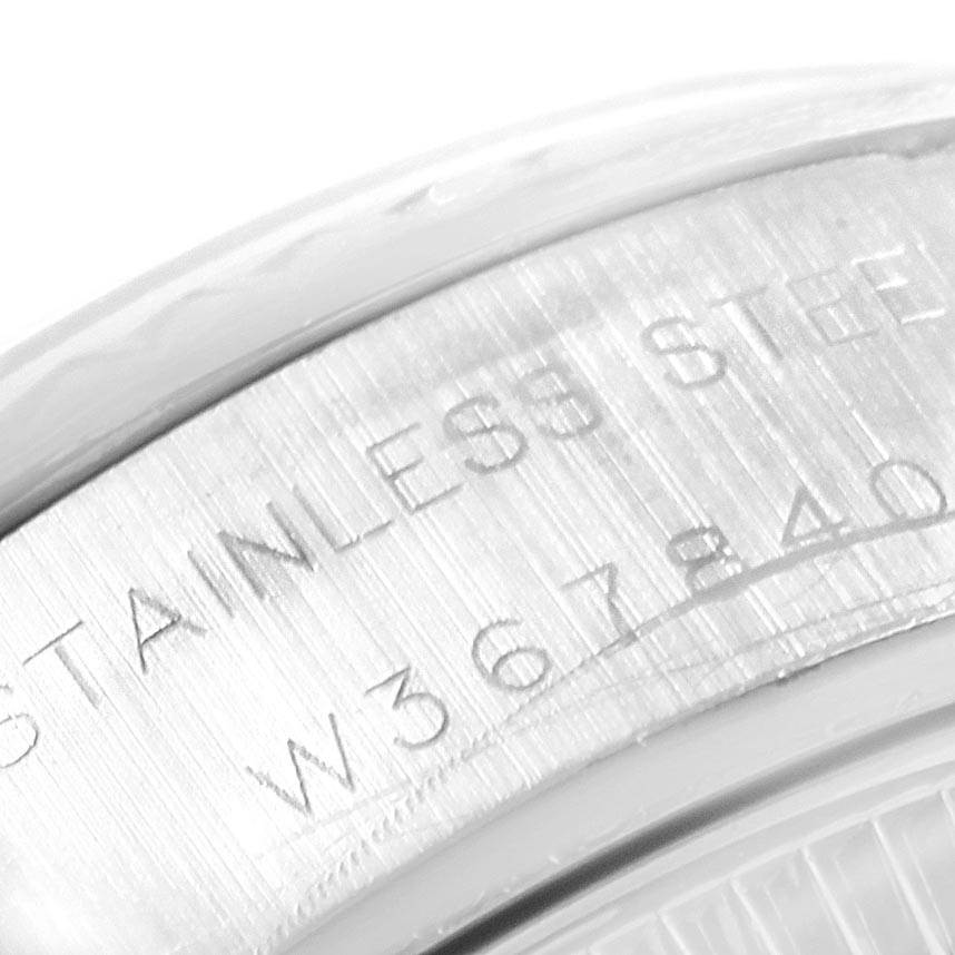 This image shows a close-up of the engraved case back of a Rolex Datejust 69174 Women's Stainless Steel Silver Dial 69174 Women's Stainless Steel Silver Dial model, highlighting the stainless steel material.