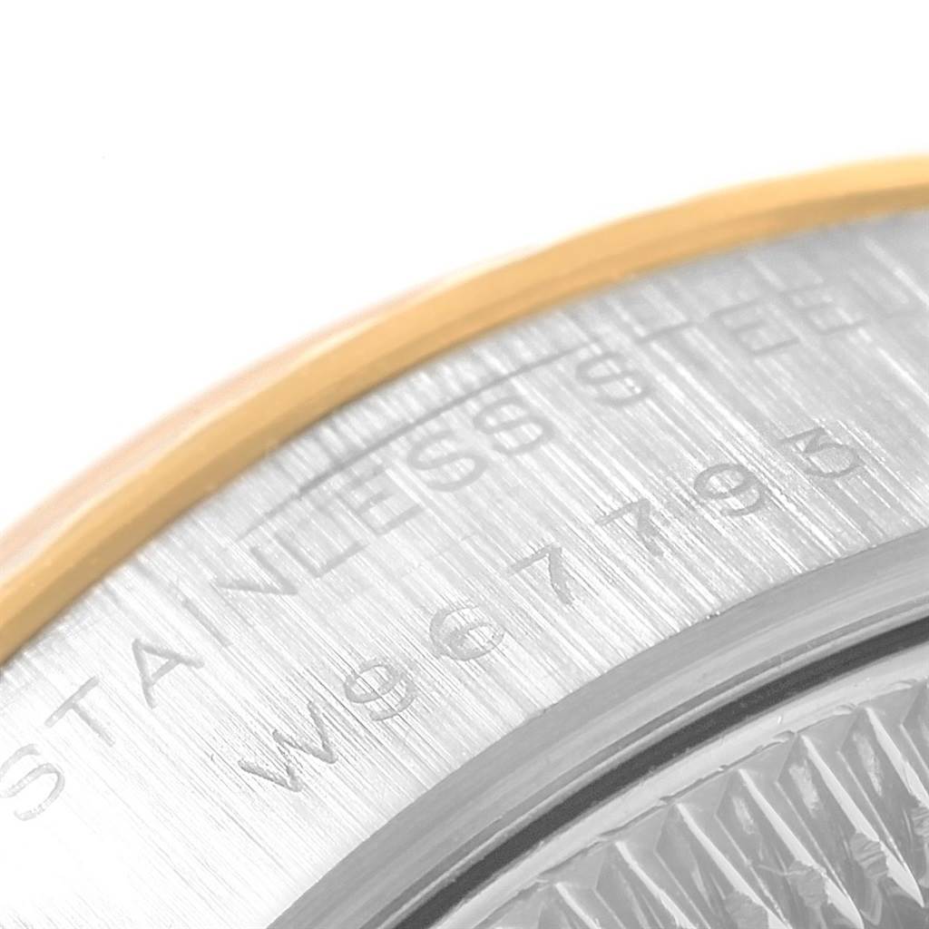 The image shows a close-up of the Rolex Datejust 69173 Women's Stainless Steel Champagne Dial 69173 Women's Stainless Steel Champagne Dial's case back, highlighting the model's serial number and "STAINLESS STEEL" engraving.