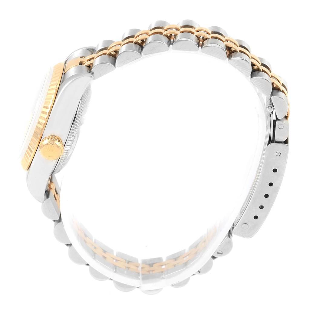 The image shows a side view of a Rolex Datejust 69173 Women's Stainless Steel Champagne Dial 69173 Women's Stainless Steel Champagne Dial watch, highlighting its crown, case, and two-tone bracelet.