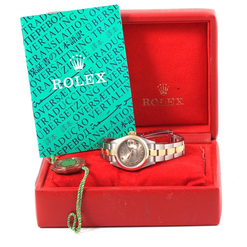 The image shows a Rolex Datejust 69163 Women's Stainless Steel Grey Dial 69163 Women's Stainless Steel Grey Dial watch and its accessories, including a tag, booklet, and red box, all in a front angle view.