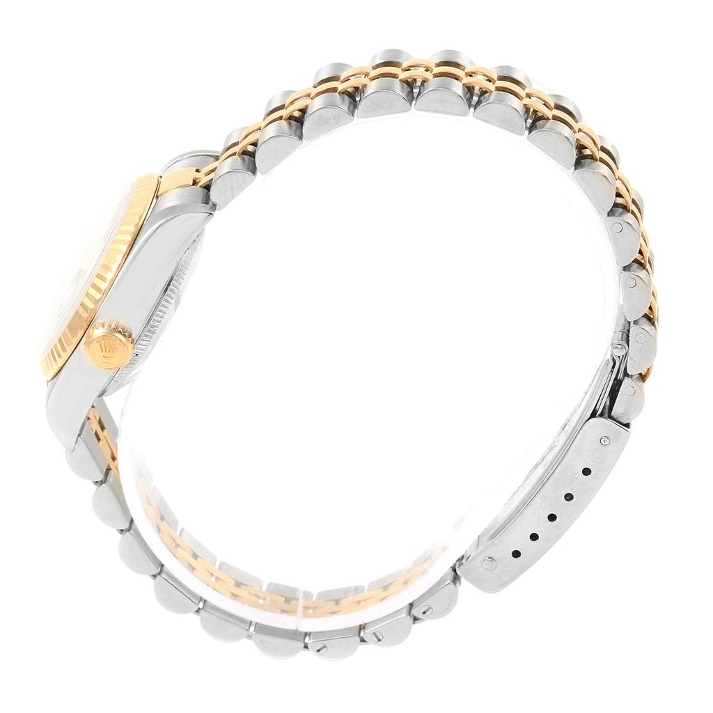 The image shows a side view of a Rolex Datejust 79173 Women's Steel and Gold (two tone) Silver Dial 79173 Women's Steel and Gold (two tone) Silver Dial watch, highlighting its two-tone bracelet and crown.