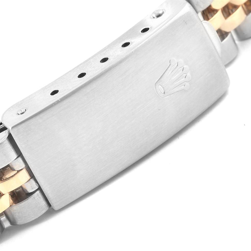 This image shows a close-up of the clasp on a Rolex Datejust 79173 Women's Steel and Gold (two tone) Silver Dial 79173 Women's Steel and Gold (two tone) Silver Dial watch, featuring the brand's logo.