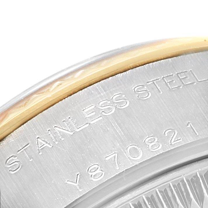 This close-up image showcases the stainless steel and gold part of the case back of a Rolex Datejust 79173 Women's Steel and Gold (two tone) Silver Dial 79173 Women's Steel and Gold (two tone) Silver Dial watch.
