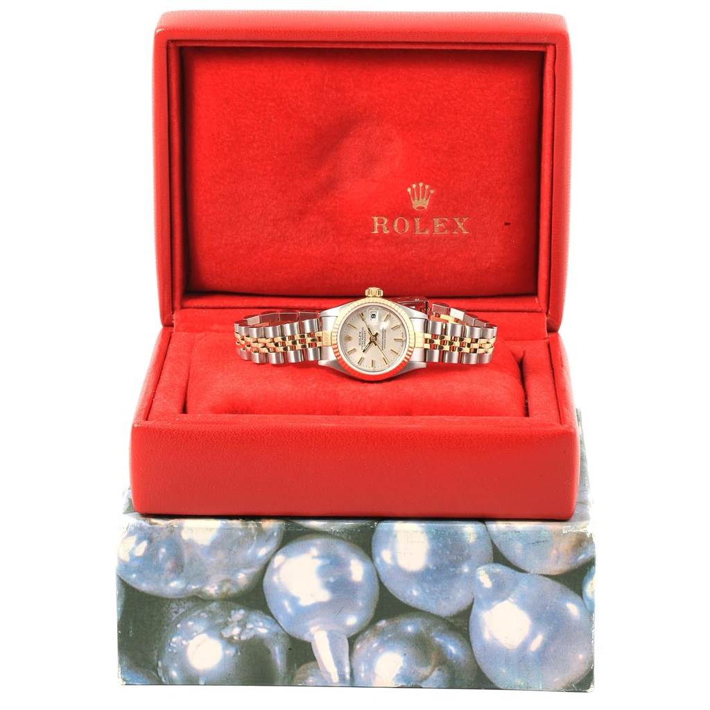 The Rolex Datejust 79173 Women's Steel and Gold (two tone) Silver Dial 79173 Women's Steel and Gold (two tone) Silver Dial watch is showcased in an open red box, displaying the face, bezel, and Jubilee bracelet.