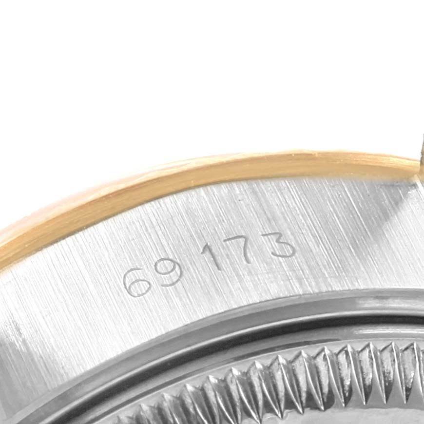 This image shows a close-up of the caseback and part of the fluted bezel of a Rolex Datejust 69173 Women's Stainless Steel Champagne Dial 69173 Women's Stainless Steel Champagne Dial, displaying the model number 69173.