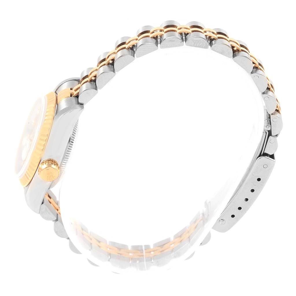 The image shows the side view of a Rolex Datejust 69173 Women's Stainless Steel Champagne Dial 69173 Women's Stainless Steel Champagne Dial watch, highlighting the case, crown, and two-tone bracelet.