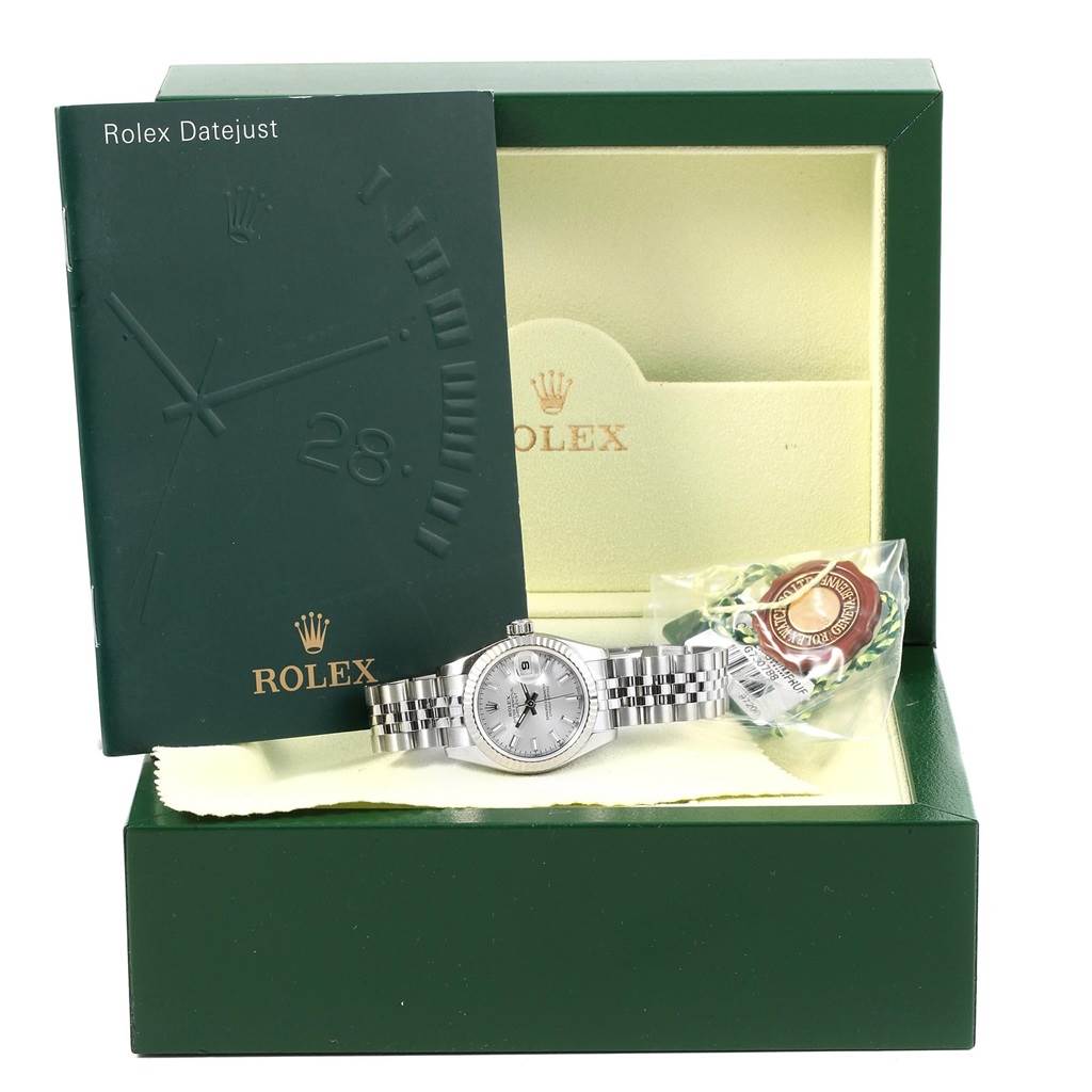 The image shows a Rolex Datejust 179174 Women's Stainless Steel Silver Dial 179174 Women's Stainless Steel Silver Dial watch at a frontal angle, with its green box, manual, and certification tag.