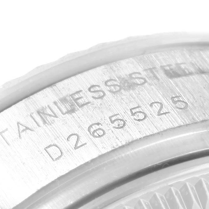 This image shows a close-up of the serial number and stainless steel marking on the caseback of a Rolex Datejust 179174 Women's Stainless Steel Silver Dial 179174 Women's Stainless Steel Silver Dial watch.