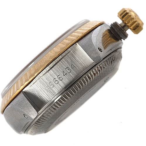 This side view of a Rolex Datejust 69173 Women's Yellow Gold Champagne Dial 69173 Women's Yellow Gold Champagne Dial watch shows its case, crown, and serial number engraving.