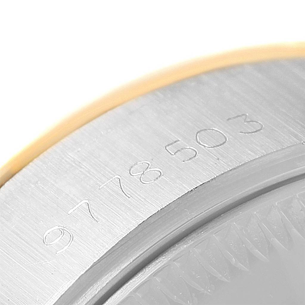 The image shows a close-up view of the engraved serial number on the case of a Rolex Datejust 69173 Women's Stainless Steel Black Dial 69173 Women's Stainless Steel Black Dial watch.