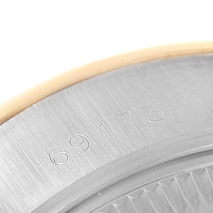 This image shows a close-up of the serial number "69173" on the outer rim of a Rolex Datejust 69173 Women's Stainless Steel Black Dial 69173 Women's Stainless Steel Black Dial watch.