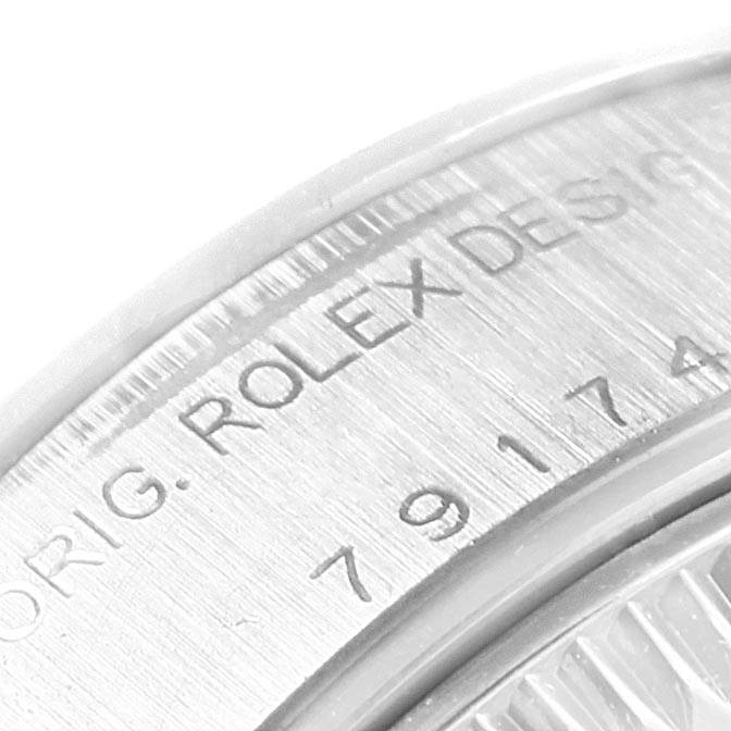The image shows a close-up of the engraved case back from a Rolex Datejust 79174 Women's Stainless Steel Mother of Pearl Dial 79174 Women's Stainless Steel Mother of Pearl Dial watch.