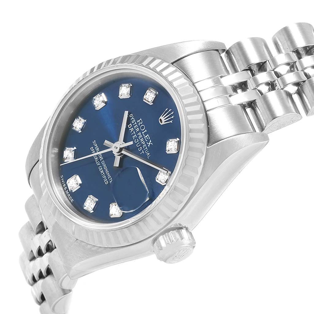 The image shows a partial side angle of a Rolex Datejust 79174 Women's Stainless Steel Blue Dial 79174 Women's Stainless Steel Blue Dial watch, highlighting the blue dial, bezel, case, crown, and bracelet.