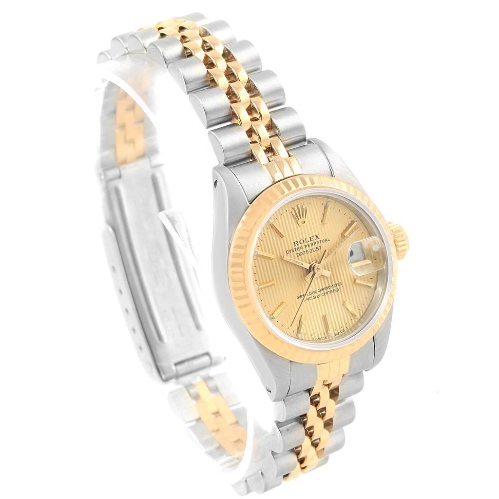 The Rolex Datejust 69173 Women's Stainless Steel Champagne Dial 69173 Women's Stainless Steel Champagne Dial watch is shown at a three-quarter angle, displaying its two-tone bracelet, fluted bezel, and date feature.