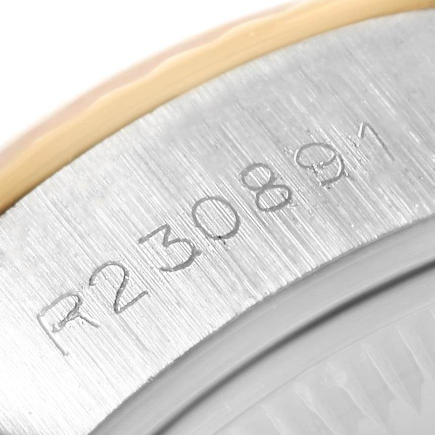 This image shows a close-up of the serial number engraving on the case back of a Rolex Datejust 69173 Women's Stainless Steel Champagne Dial 69173 Women's Stainless Steel Champagne Dial watch.