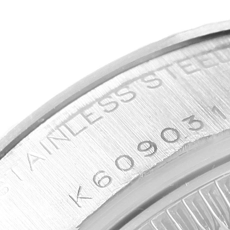 This image shows the edge of the case back of a Rolex 79174 Men's Stainless Steel Blue Dial 79174 Men's Stainless Steel Blue Dial Datejust Steel White Gold Blue Diamond Dial Ladies Watch 79174 model.