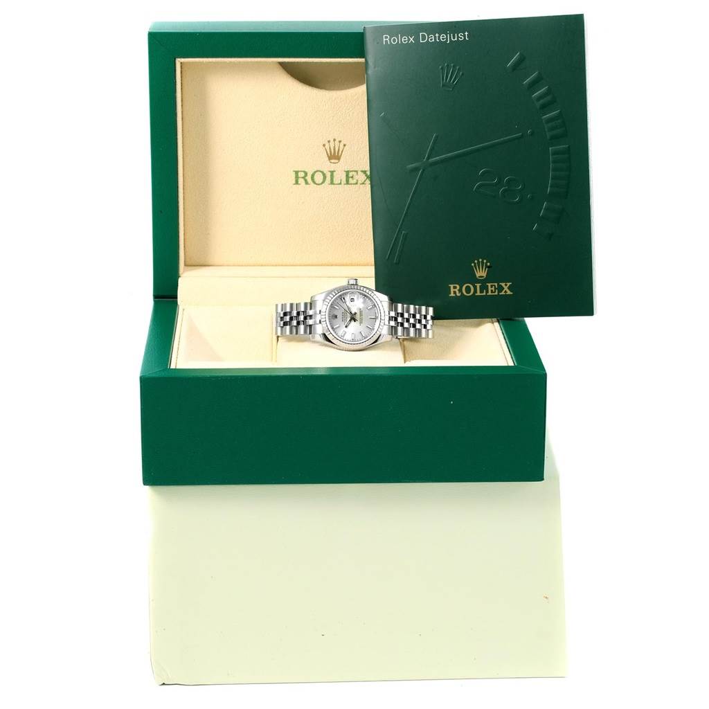 The image shows a Rolex Datejust 179174 Women's Stainless Steel Silver Dial 179174 Women's Stainless Steel Silver Dial watch positioned in an open green Rolex box with the instruction manual displayed beside it.