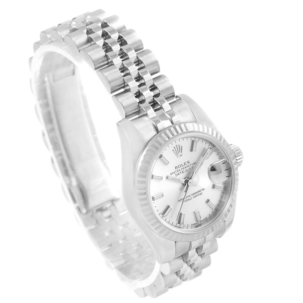 The image shows a Rolex Datejust 179174 Women's Stainless Steel Silver Dial 179174 Women's Stainless Steel Silver Dial watch at a three-quarter angle highlighting its white dial, fluted bezel, and Jubilee bracelet.
