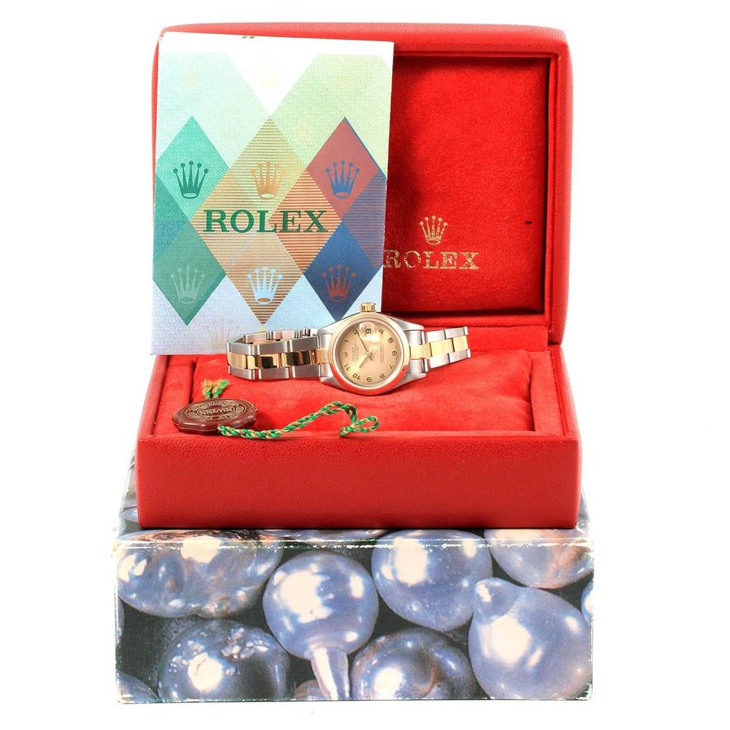 The image shows a Rolex Datejust 79163 Women's Steel and Gold (two tone) Champagne Dial 79163 Women's Steel and Gold (two tone) Champagne Dial watch with its booklet and tag, displayed in an open red box at a front angle.
